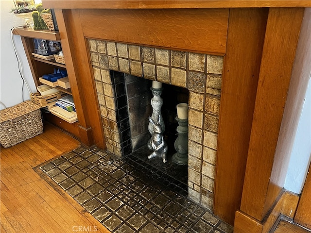 interior details featuring a fireplace and hardwood / wood-style flooring