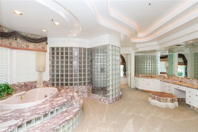 bathroom with vanity and a bathtub