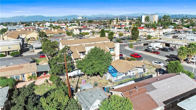 birds eye view of property featuring a mountain view