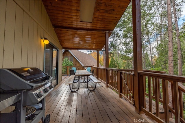 wooden deck featuring grilling area