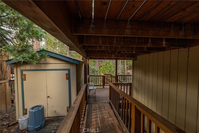 wooden deck featuring a shed