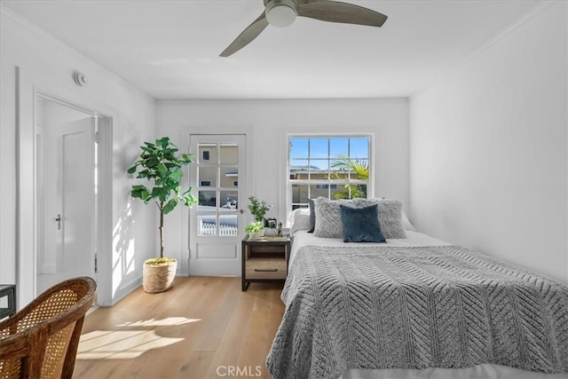 bedroom featuring light wood-type flooring and ceiling fan