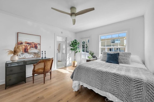 bedroom with connected bathroom, light hardwood / wood-style floors, and ceiling fan