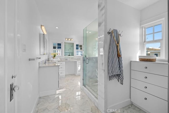 bathroom with vanity and an enclosed shower