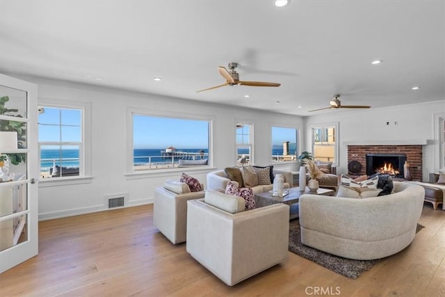 1000 The Strand, Manhattan Beach, CA 90266 - living room featuring a fireplace, light wood-style floors, baseboards, a ceiling fan, and recessed lighting