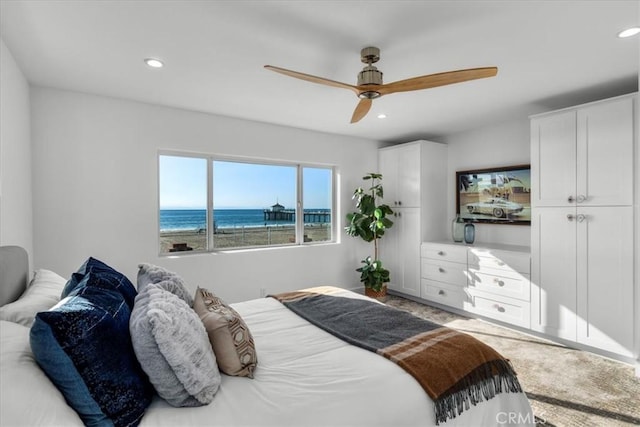 carpeted bedroom with ceiling fan