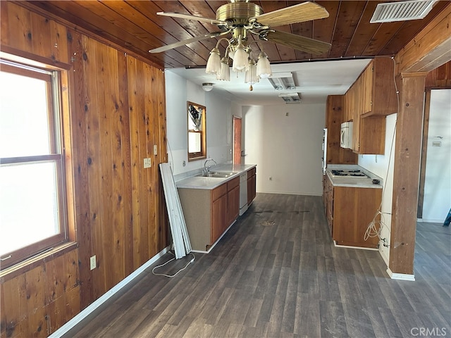 kitchen featuring wooden ceiling, sink, wooden walls, and white appliances