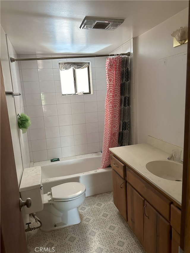 full bathroom with toilet, vanity, and shower / bath combo with shower curtain