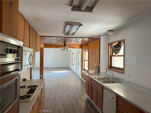 kitchen featuring white appliances, wood ceiling, dark hardwood / wood-style flooring, sink, and ceiling fan