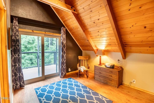 interior space featuring access to outside, vaulted ceiling with beams, wooden ceiling, and hardwood / wood-style flooring