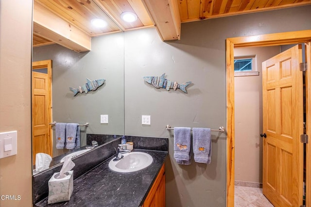 bathroom featuring tile patterned floors, vanity, and wooden ceiling