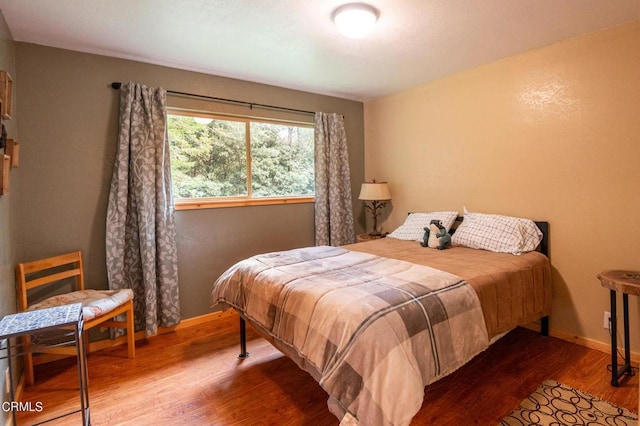 bedroom featuring hardwood / wood-style flooring