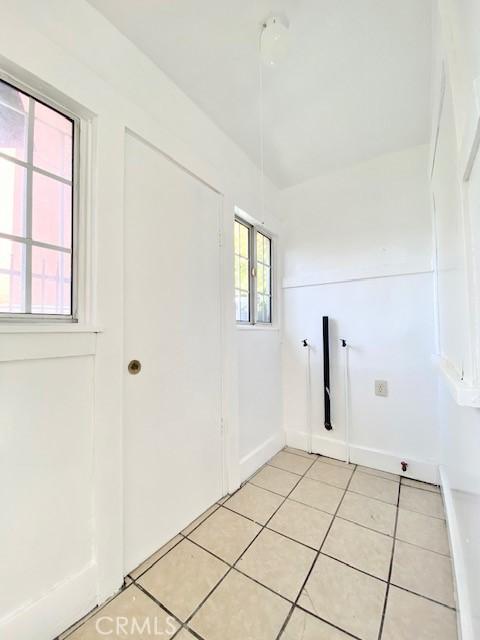 laundry room with light tile patterned floors