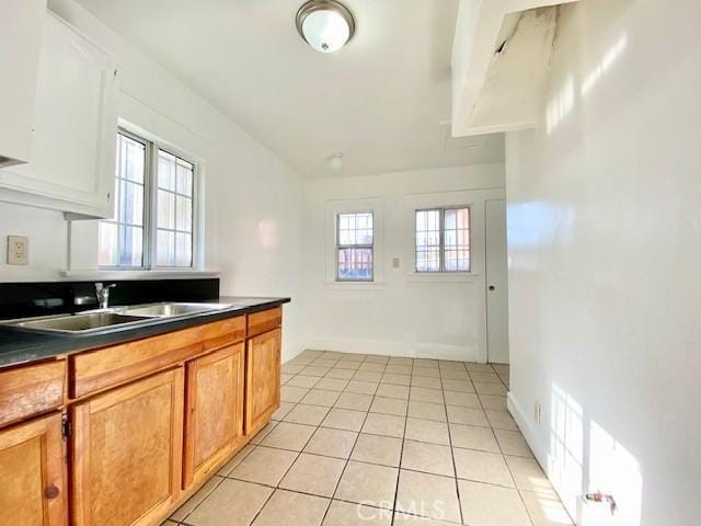 kitchen with sink and light tile patterned floors