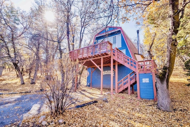 view of playground featuring a wooden deck