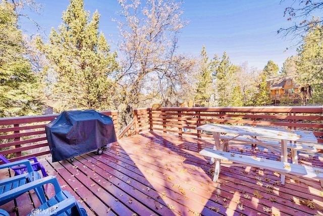 wooden deck featuring grilling area