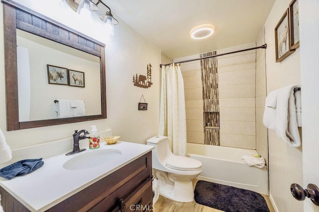 full bathroom with hardwood / wood-style flooring, vanity, toilet, and shower / tub combo