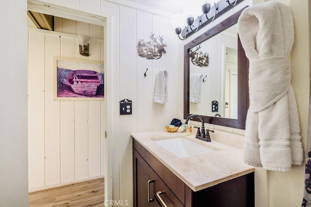 bathroom with vanity and hardwood / wood-style floors