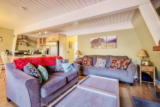 living room with wooden ceiling, beam ceiling, and light hardwood / wood-style flooring