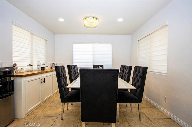 dining area featuring light tile patterned floors