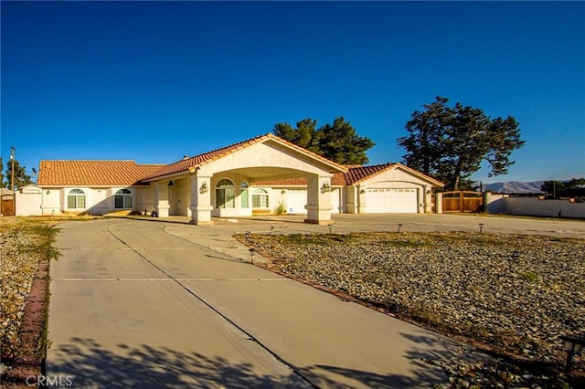 mediterranean / spanish house featuring a garage