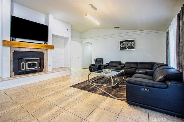 living room with lofted ceiling and light tile patterned flooring