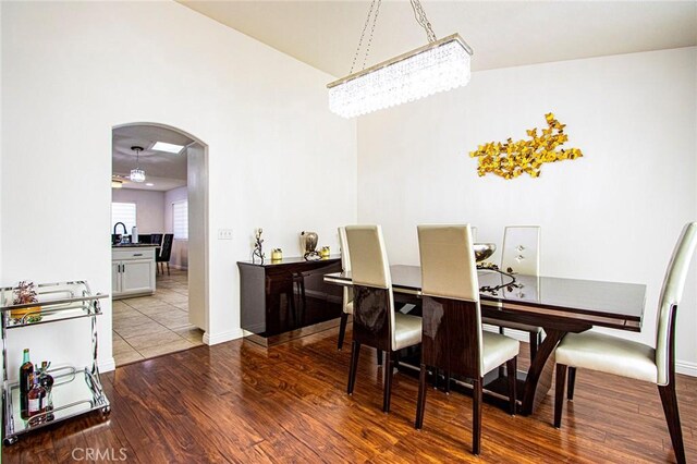 dining area with a chandelier and hardwood / wood-style flooring