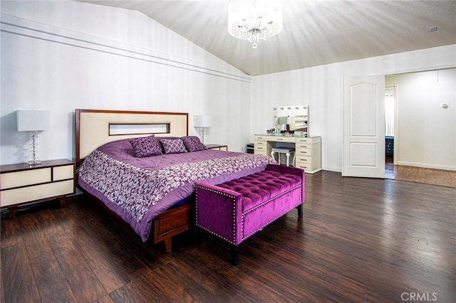 bedroom featuring dark wood-type flooring, vaulted ceiling, and a notable chandelier