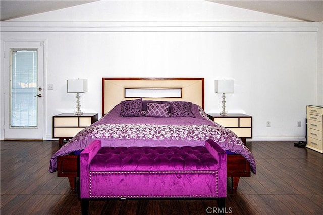 bedroom with dark hardwood / wood-style flooring and lofted ceiling