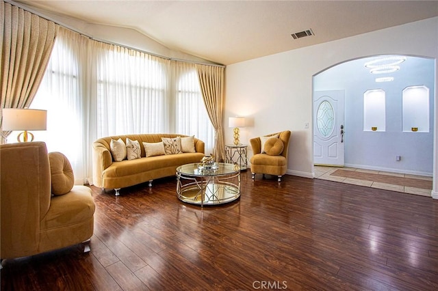 living room featuring hardwood / wood-style floors and lofted ceiling