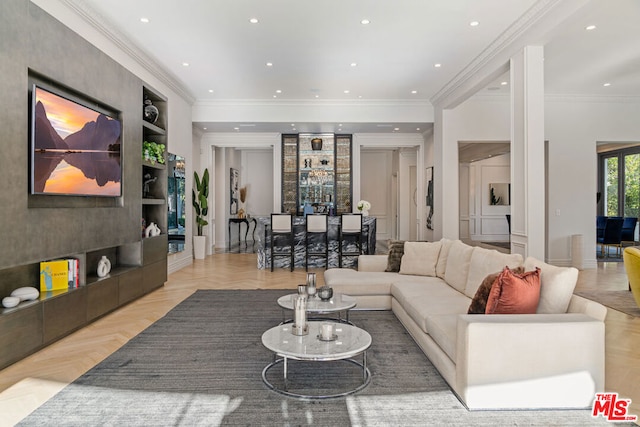 living room with light parquet flooring, ornamental molding, indoor bar, and built in features