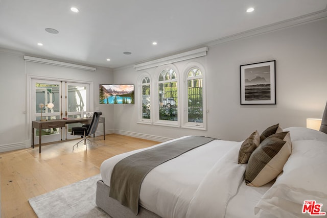 bedroom featuring light hardwood / wood-style floors and ornamental molding