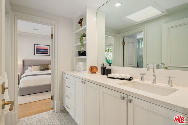 bathroom with vanity and tile patterned flooring