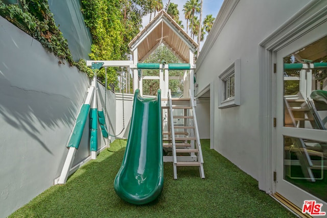 view of play area with a lawn