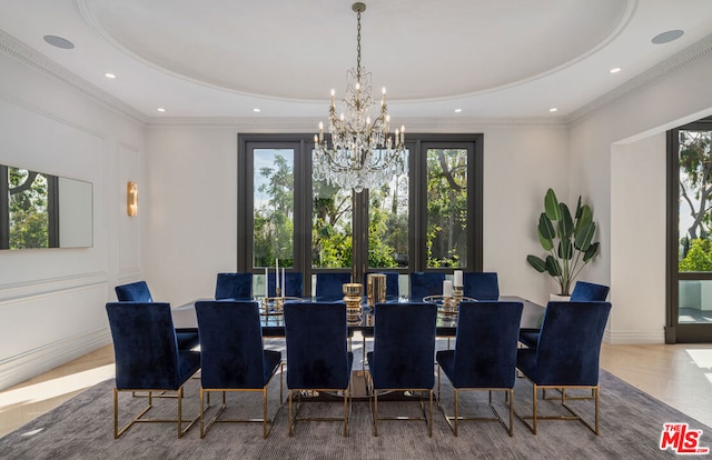 dining room featuring a notable chandelier, crown molding, a healthy amount of sunlight, and a tray ceiling