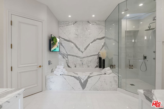 bathroom with vanity and a shower with shower door