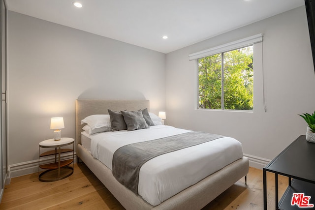 bedroom featuring light wood-type flooring