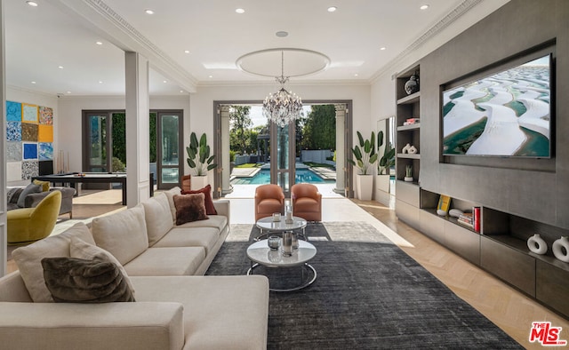 living room with a notable chandelier, crown molding, light parquet flooring, and built in features