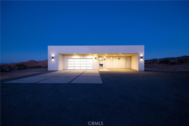 view of front of house featuring a mountain view and a garage