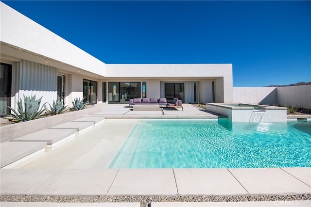 view of swimming pool with a patio area, an in ground hot tub, pool water feature, and an outdoor hangout area