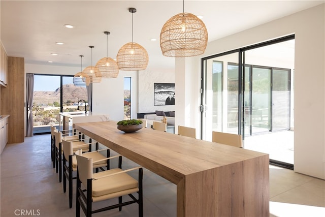 dining space with a mountain view and sink