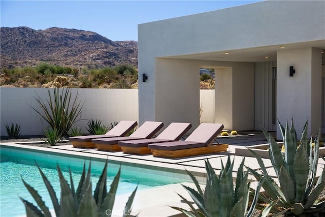 view of swimming pool featuring a mountain view