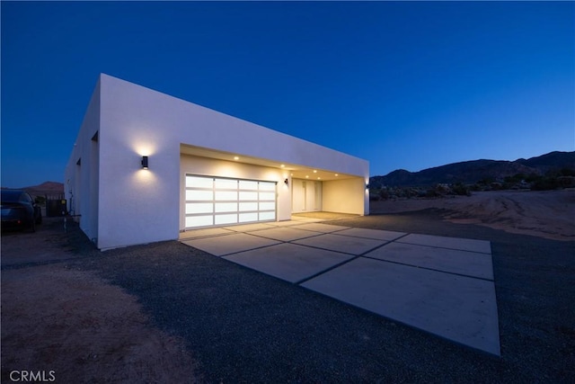 exterior space featuring a mountain view and a garage