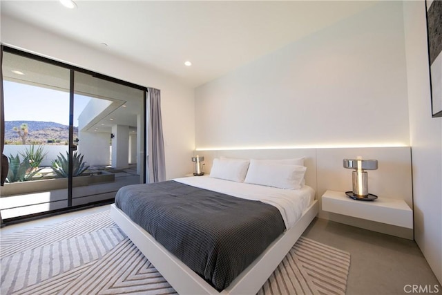 bedroom featuring a mountain view and carpet