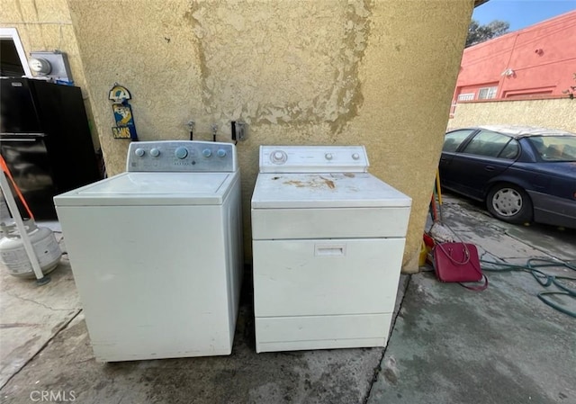 laundry area featuring independent washer and dryer