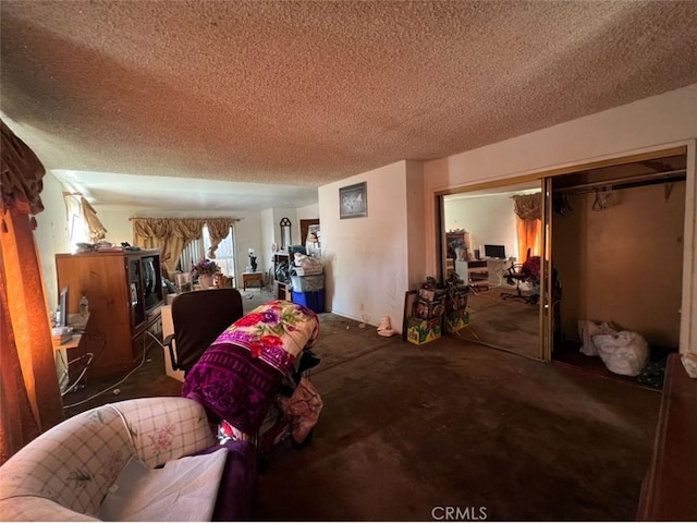 carpeted bedroom featuring a closet and a textured ceiling