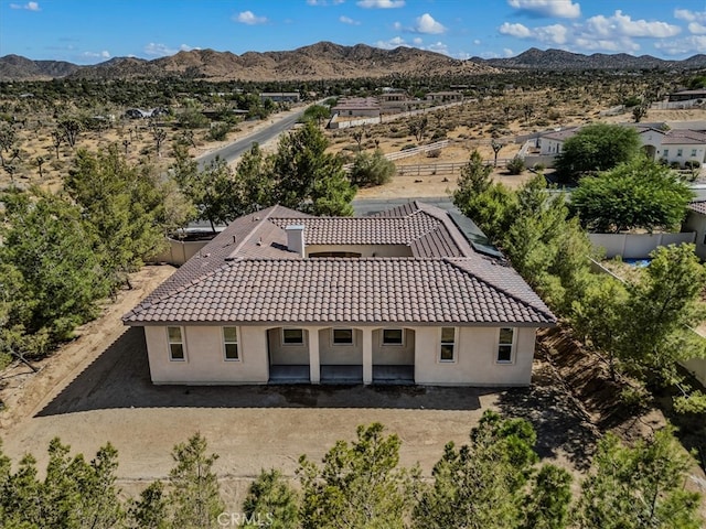 birds eye view of property with a mountain view