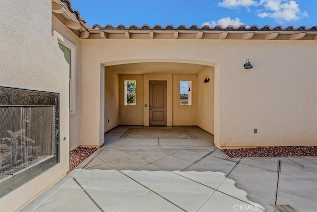 doorway to property featuring a patio