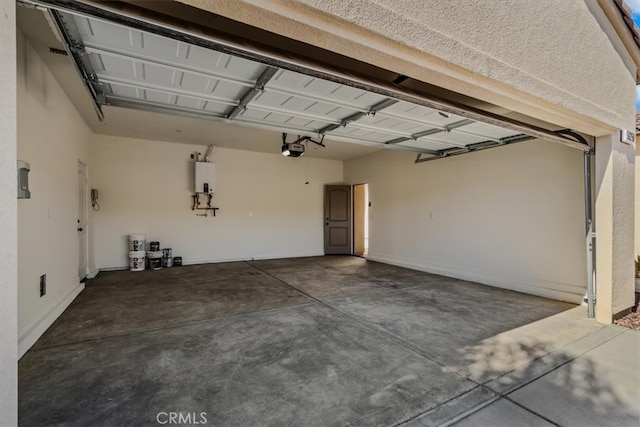 garage with a garage door opener and water heater