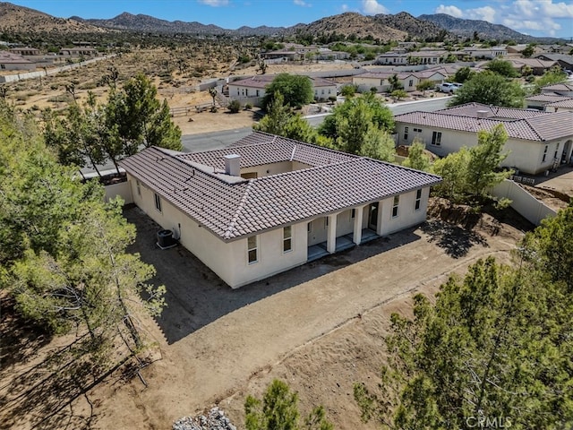 birds eye view of property with a mountain view